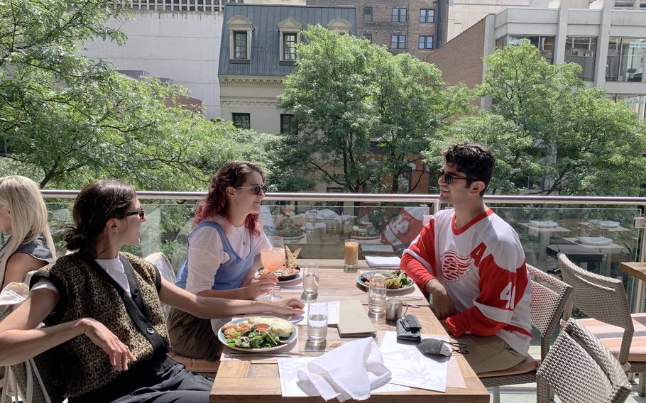 The three have lunch at Fig & Olive in Chicago’s ritzy Gold Coast.