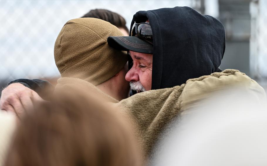 An airman with the 445th Airlift Wing reunites with a family member at Wright-Patterson Air Force Base, Ohio, Jan. 4, 2024. 