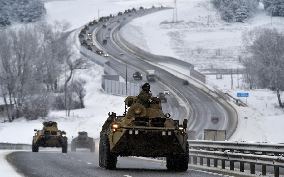 A convoy of Russian armored vehicles moves along a highway in Crimea, Tuesday, Jan. 18, 2022. The Pentagon has established a communication line to the Russian Defense Ministry in attempts to reduce the risk of dangerous misunderstandings as Russia wages war in Ukraine, a U.S. defense official said Thursday, March 3, 2022.