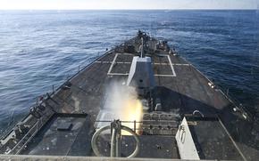 A missile fires from a Navy destroyer.