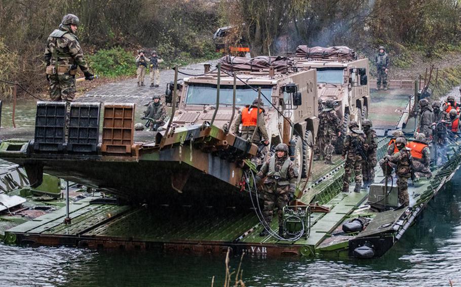 French troops cross a body of water in an undated file photo. France will take command of NATO’s Very High Readiness Joint Task Force in 2022, at a time of heightened wariness in the alliance over Russian assertiveness in Europe. 