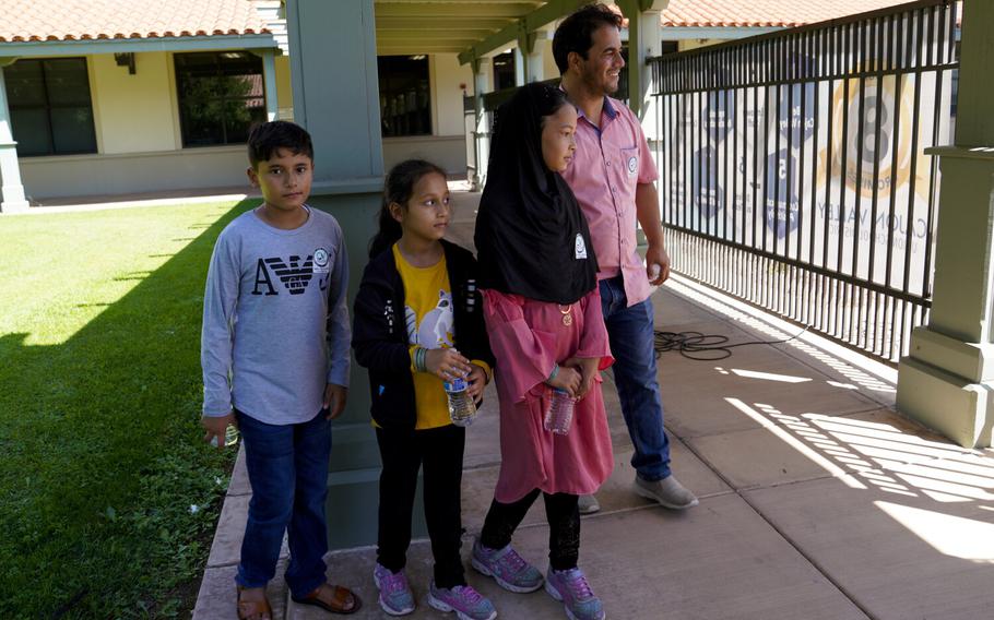 In El Cajon, CA., at Cajon Valley Union School District office on Thursday, Sept. 2, 2021, Mohammad Faizi spoke about the difficulty of gaining access to enter Kabul airport with his wife and their 5 children. The family of seven then waited several days at the airport before being evacuated out of Afghanistan, back to the U.S. where they live in El Cajon, Calif. Left to right, Ahmad, 13, Parwana, 7, Palwasha, 10, and Mohammad Faizi.