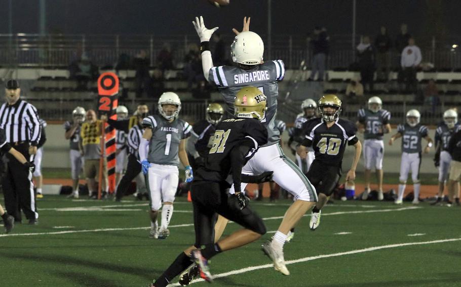 Singapore's Quentin Chong goes up to catch a pass in front of Humphreys' Cameron Sherlock.