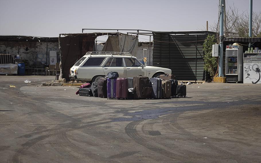 Luggage at a bus stop near Aswan, Egypt, on April 27, 2023. Some Sudanese who can afford the trip are traveling to Egypt to escape the conflict at home. 