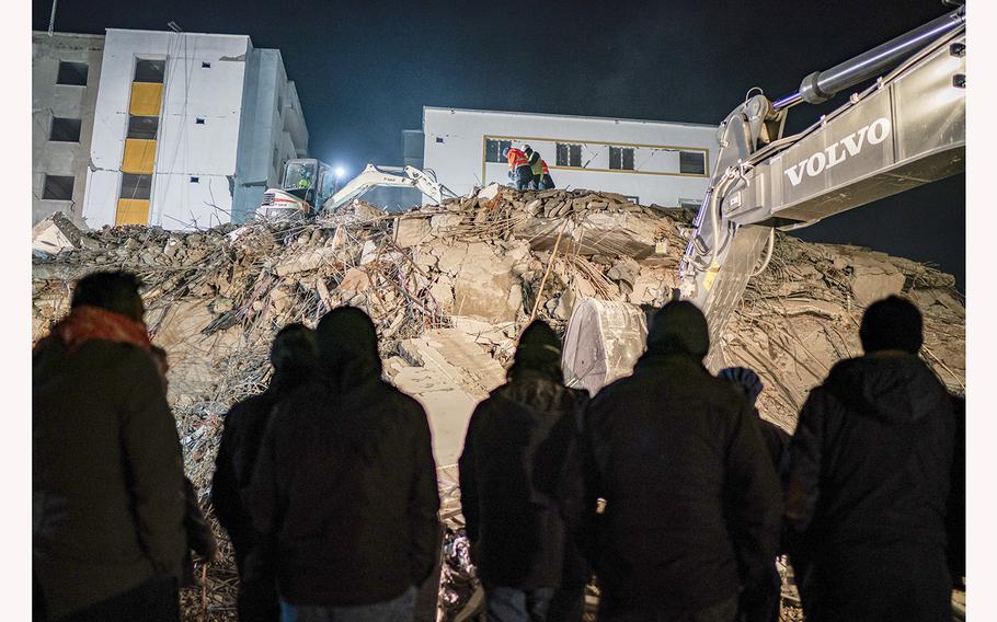 Rescue workers look through the rubble for survivors in the Turkish town of Nurdagi on Feb. 9, 2023.