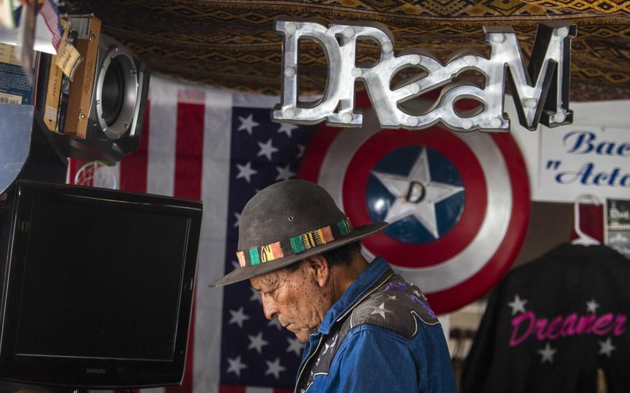 Barber Tony Bravo, known as “Dreamer,” is seen inside the Barber Shop on the West Los Angeles Veterans Affairs campus on June 15, 2022, in Los Angeles, California. 