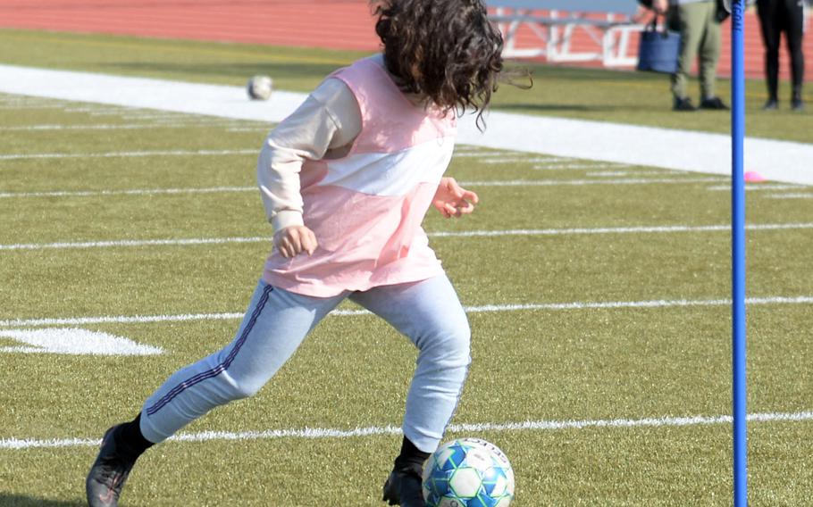 Sasha Malone's face may be hard to see at times what with the hair, but Matthew C. Perry's soccer freshman is being counted on to keep a clear view on the defensive end.
