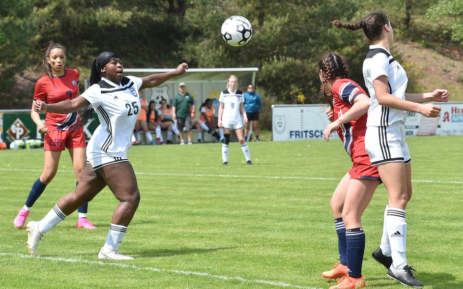 SHAPE's Nyla Williamson prepares to control a cross into the box during the Spartans' pool-play match with Lakenheath on May 15, 2023, in Reichenbach-Steegen, Germany. In back left in the Lancers' A'Lydia McNeal.