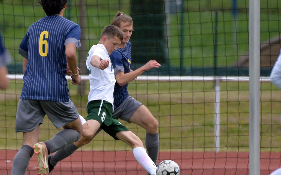 AFNORTH’s Michael Teichi scores an early goal against Ansbach in a Division III semifinal in Kaiserslautern, Germany, May 17, 2023, as Ansbach’s Alexander Pohlman tries to defend. Ansbach went on to beat AFNORTH 5-3 and will face Sigonella in Thursday’s final in Ramstein. Ansbach’s Fox Larson watches the action at left.