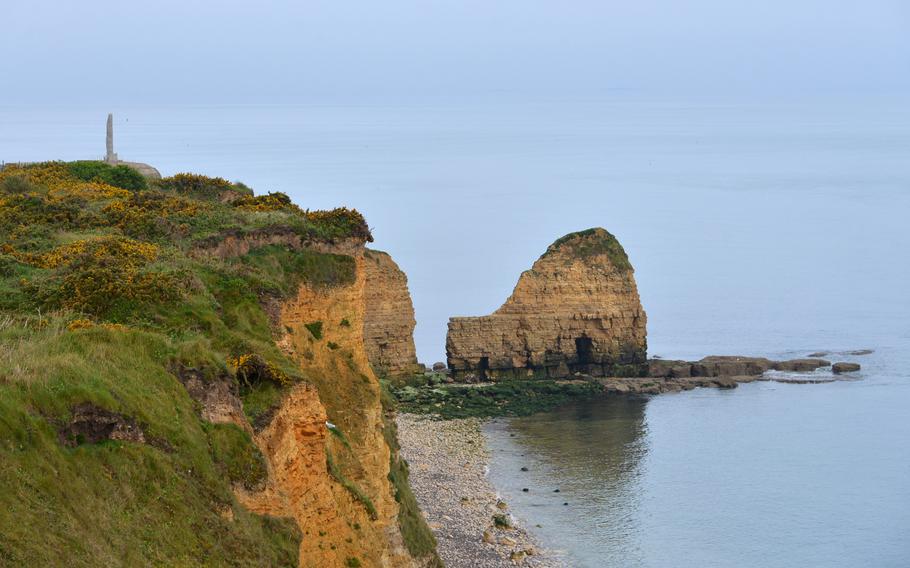 The Ranger Memorial at Pointe du Hoc, left, stands atop the cliffs that Lt. Col. James Rudder and his men of the 2nd Ranger Battalion fought their way up to capture a German gun position.