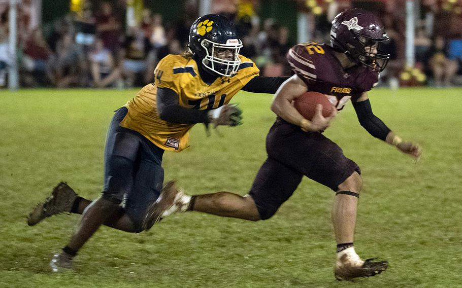 Guam High's Justin Brantley, left, had six tackles, one for a loss, against Father Duenas Memorial.