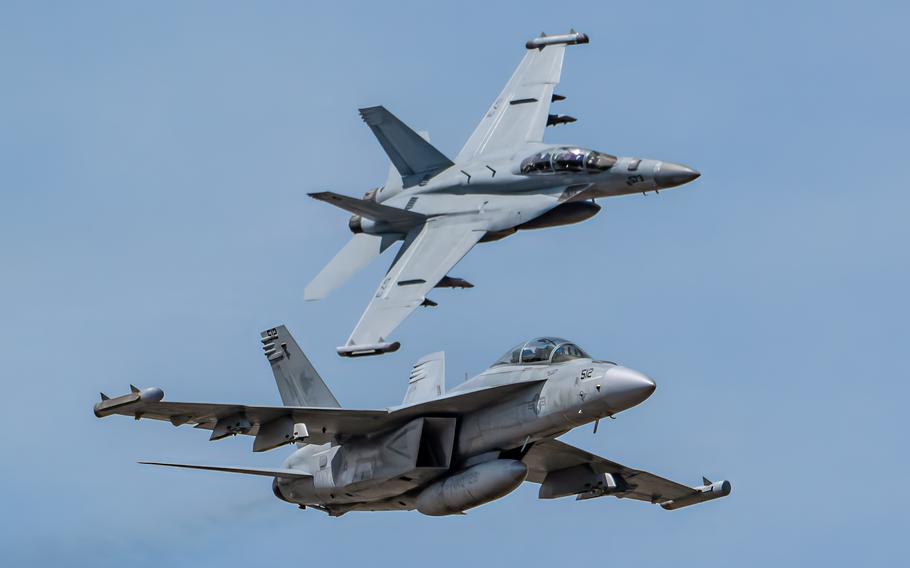 The U.S. Navy’s EA-18G Growler Demonstration Team, from Naval Air Station Whidby Island, Wash., performs an aerobatic display during the Thunder Over Louisville air show in Louisville, Ky., Saturday, April 20, 2024.