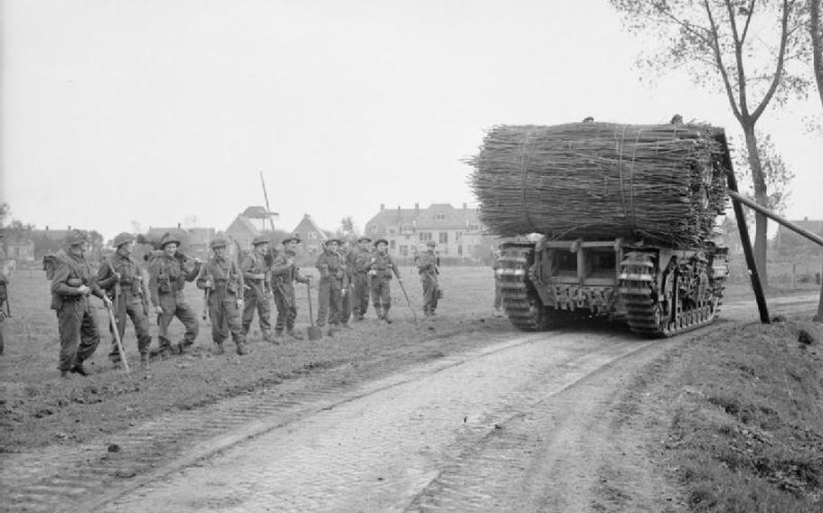 A black and white photo of a Fascine Carrier Tank, a huge bundle of sticks