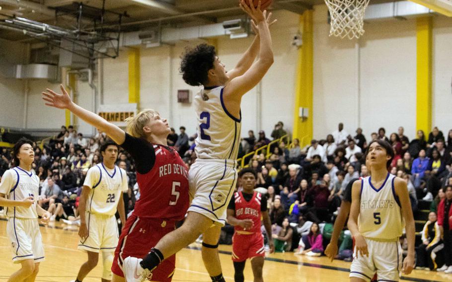 St. Mary’s Michael Wahba skies for a shot against Nile C. Kinnick. The Titans won the ASIJ Kanto Classic final on a last-second bucket 40-38.