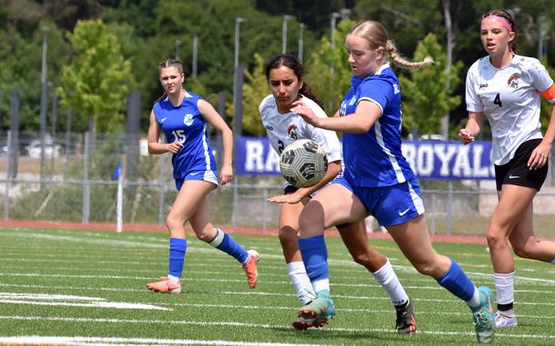Ramsteins Claire Boynton and Kaiserslauterns Marisol Baltazar battle for the ball during the DODEA-Europe Division I girls soccer semifinals on Wednesday at Ramstein Air Base, Germany, May 21, 2025. The No. 1 seed Royals won 5-2 and will face Stuttgart Thursday in the finals.