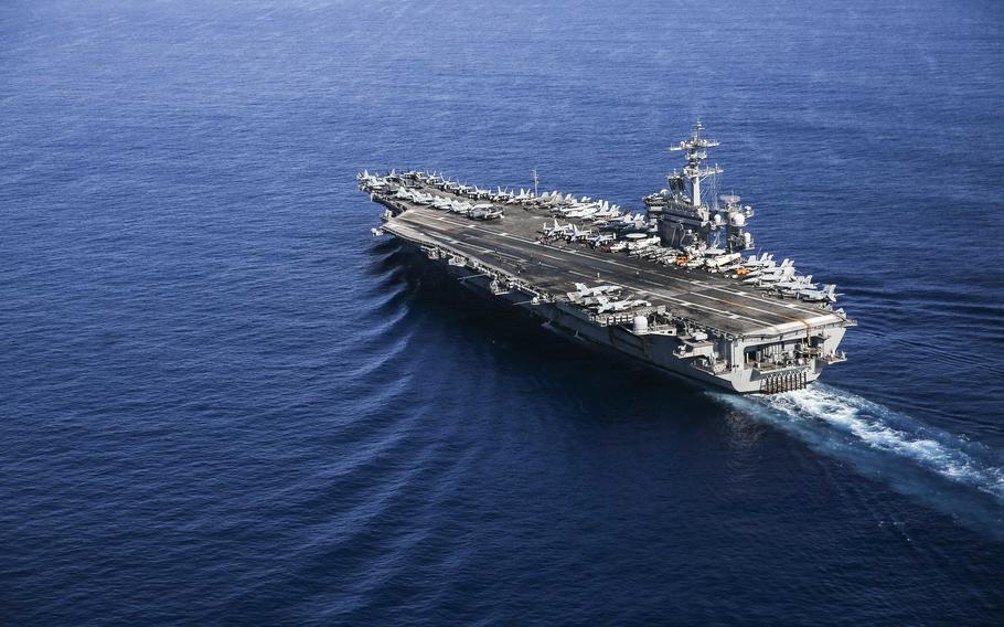 The aircraft carrier USS Abraham Lincoln sails through the South China Sea, April 1, 2022.