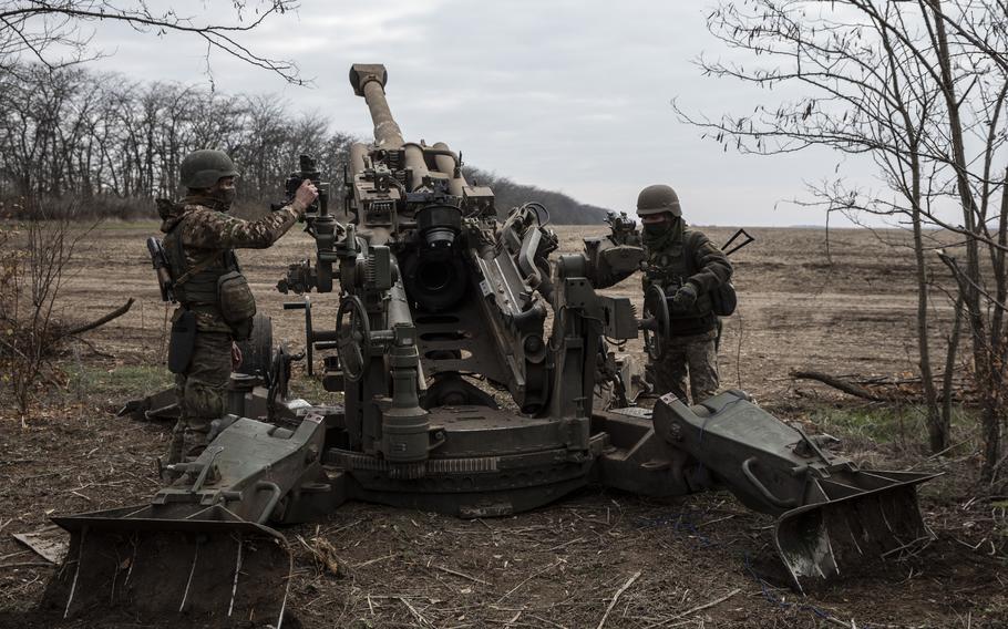 The Ukrainian artillery unit firing an M777 howitzer at Russian armored vehicles near Snihurivka.