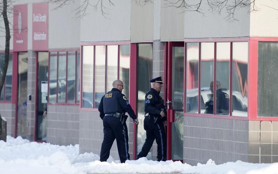 Law enforcement officers enter the Starts Right Here building, Monday, Jan. 23, 2023, in Des Moines, Iowa. Police say two students were killed and a teacher was injured in a shooting at the Des Moines school on the edge of the city’s downtown. 