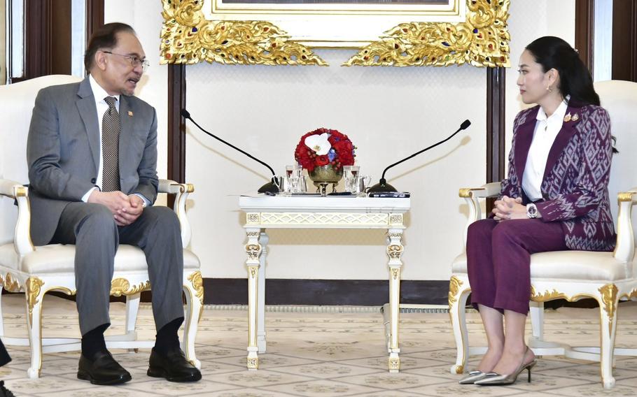 Malaysian Prime Minister Anwar Ibrahim, left, meets Thailand’s Prime Minister Paetongtarn Shinawatra, right, at the Government house in Bangkok, Thailand.