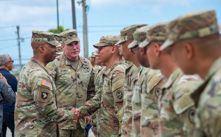 The head of U.S. Army Pacific, Gen. Ronald Clark, shakes the hand of a soldier.