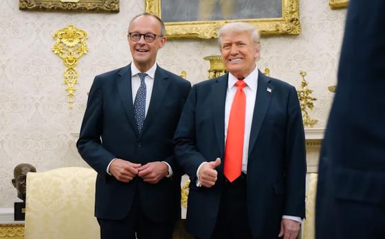 German Chancellor Friedrich Merz poses with U.S. President Donald Trump.