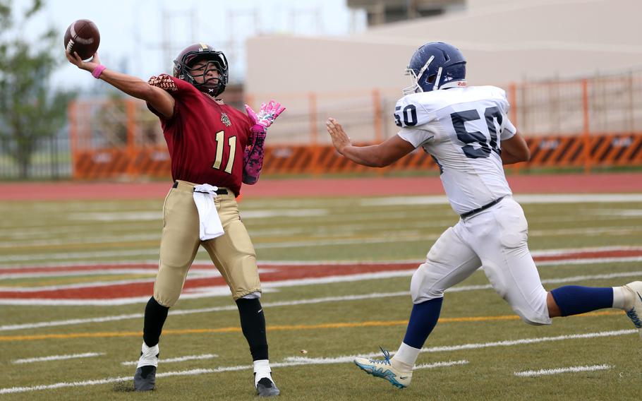 Matthew C. Perry's Kameron Ramos lets a pass fly against Sotoku. The Samurai won 28-6.