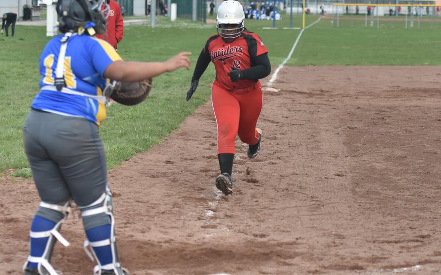 Senior Bev Clearke sprints home to score the game-winning run against Wiesbaden on March 16, 2024 in Wiesbaden, Germany.  The Raiders won 21-20 in extra innings. 