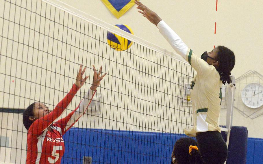 Robert D. Edgren freshman middle Elizabeth Johnson, right, has stood tall along with her Eagles teammates; they've gone 12-0 this season without dropping a set.