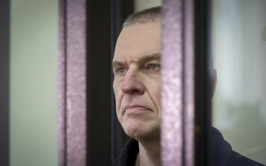 Journalist Andrzej Poczobut stands in a defendants’ cage during a court session in Grodno, Belarus, on Jan. 16, 2023. Belarus’ Supreme Court on Friday, May 26, 2023, upheld an eight-year prison sentence that was handed to a journalist and prominent member of the country’s sizeable Polish minority as part of the government’s sweeping, years-long crackdown on opposition figures, human rights activists and independent reporters. The Court rejected the appeal of Andrzej Poczobut, a 50-year-old reporter with Gazeta Wyborcza, an influential Polish newspaper.