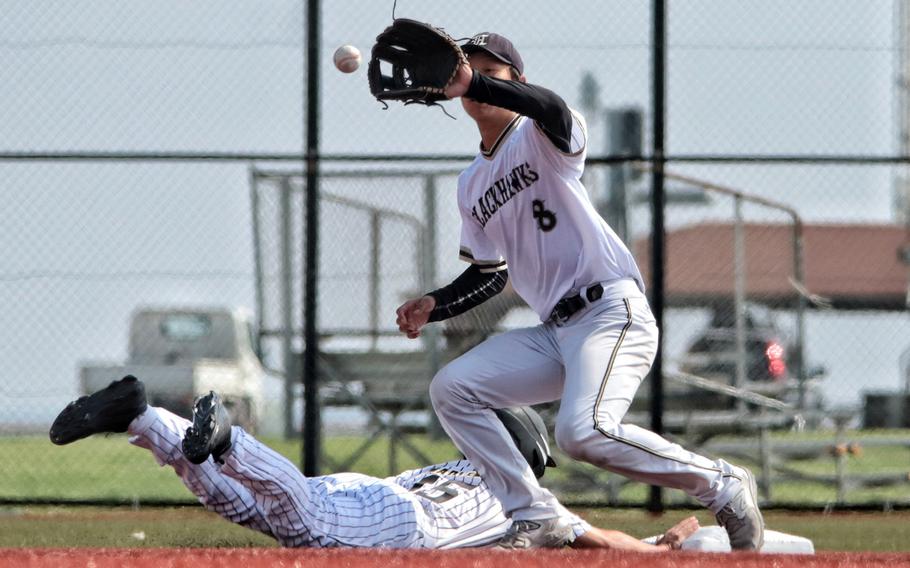Humphreys' Eric Ji takes the throw at second base too late to nail Kadena's James Ingram III.
