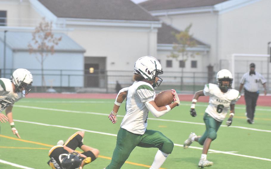 Naples' Gab'riel Doran eludes a Vicenza defender on the way to a 13-yard touchdown that put the Wildcats up 14-0 during their 40-0 victory over the Cougars on Friday, Sept. 22, 2023.