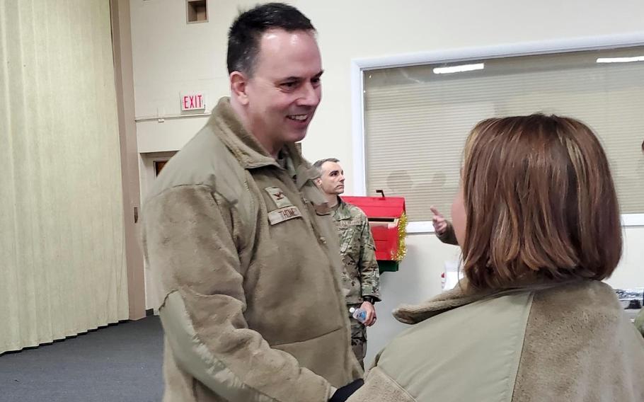 Col. Deane Thomey, commander of 111th Attack Wing, is greeted upon his return to duty by Senior Master Sgt. Holly Schlittler at Biddle Air National Guard Base, Pa., March 30, 2022. 