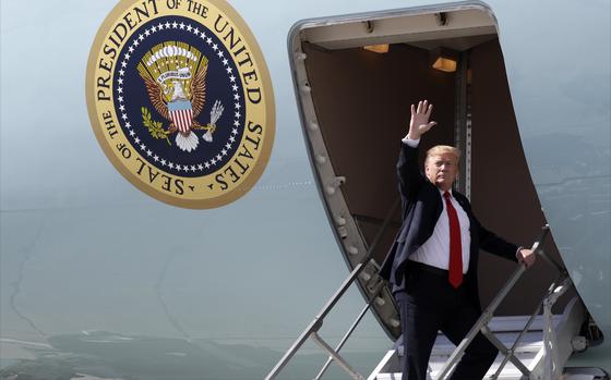 FILE - President Donald Trump waves after greeting troops at Joint Base Elmendorf-Richardson for a refueling stop en route to Japan, May 24, 2019, in Anchorage. (AP Photo/Evan Vucci, File)
