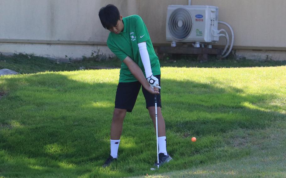 Daegu's Max Lim pitches out of trouble during Tuesday's DODEA-Korea golf matches at Camp Walker's Evergreen links. Lim lost 9 and 8 to Humphreys' Hugo Oweling.