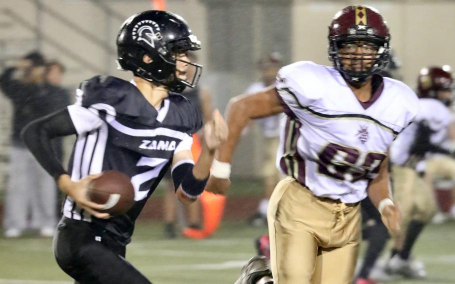 Adrian Santiago-Cruz runs with the football.