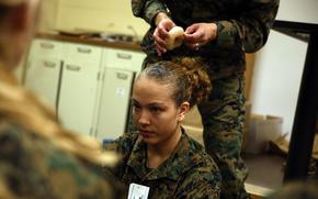 Female Marines may sport one unsecured half ponytail or up to two unsecured half braids, according to the new regulations. Women with short hair may wear it in twists.
