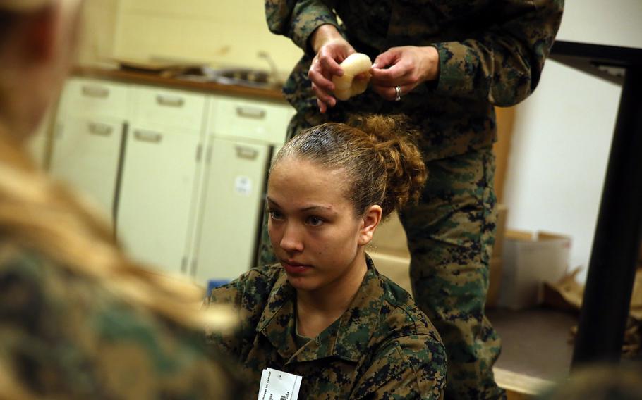 Female Marines may sport one unsecured half ponytail or up to two unsecured half braids, according to the new regulations. Women with short hair may wear it in twists.