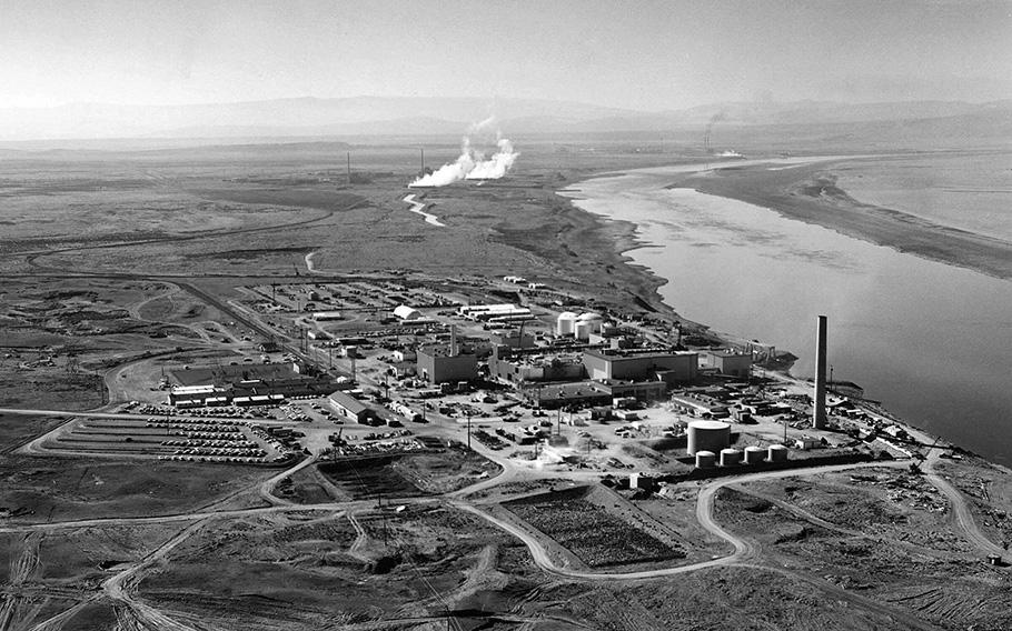 Nuclear reactors line the riverbank at the Hanford site along the Columbia River in January 1960. The site was chosen for its isolated location and proximity to the cold water of the Columbia, which were used to cool nuclear reactors. 