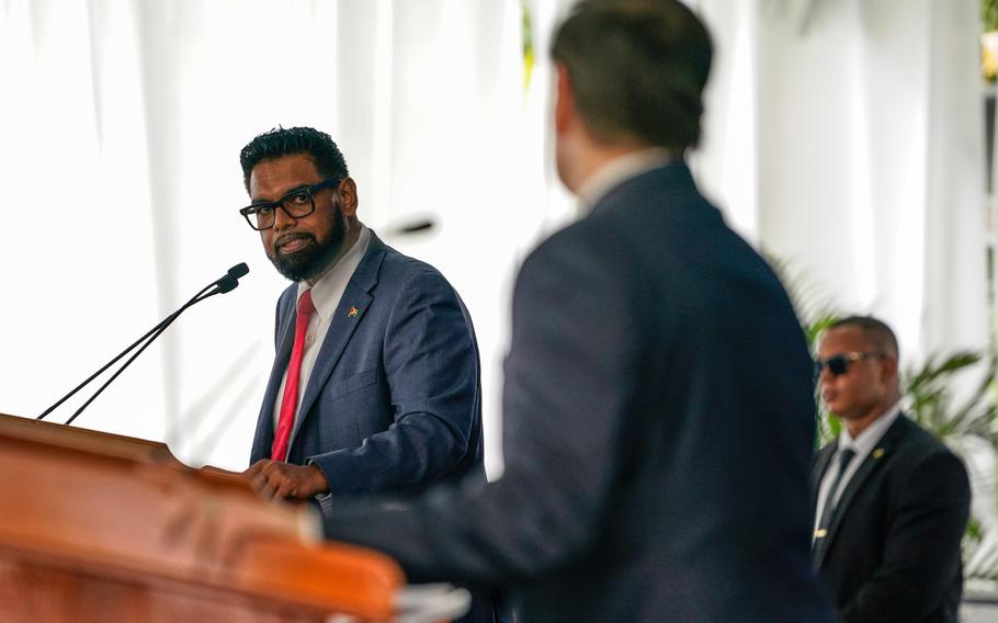Guyanese President Mohamed Irfaan Ali looks at Secretary of State Marco Rubio