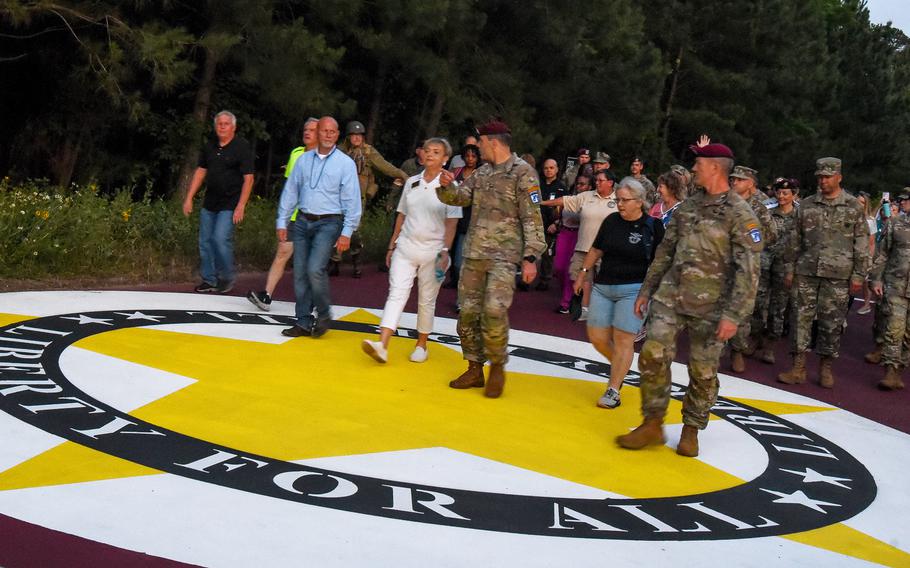 Marchers participate Thursday, June 1, 2023, in the inaugural Sunset Liberty March during the last sunset over Fort Bragg, N.C., which was renamed Fort Liberty on Friday, June 2, 2023. The march will be held every night at Fort Liberty to honor fallen service members. 