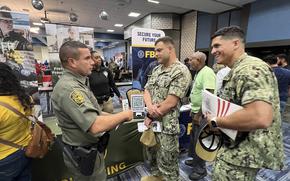 Hundreds of service members, civilians, families, and members of the community gathered at the installation's Community Club on Jun 26, to participate in the Fort Buchanan Hiring and Education Fair, organized by the Transition Assistance Program (TAP).