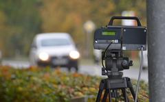 An automatic speed camera enforces the speed limit on a German roadside. Higher fines for speeding and illegal parking will take effect in Germany in November. Failure to build an emergency lane, or driving through an emergency lane will get your license suspended for a month plus a fine.