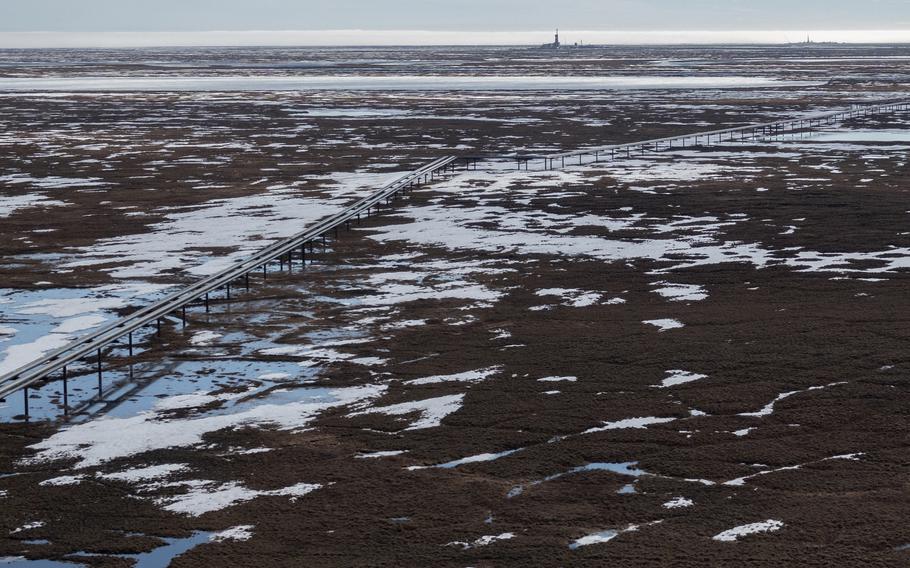 Oil pipelines stretch across the landscape outside Nuiqsut, Alaska, where ConocoPhillips operates the Alpine Field on May 28, 2019. 