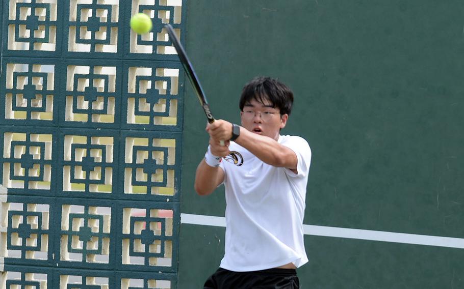 Humphreys' Elliott Lee swats a backhand during his 6-0, 6-3 Far East tournament boys singles final loss to Yokota's Ryunosuke Roesch.