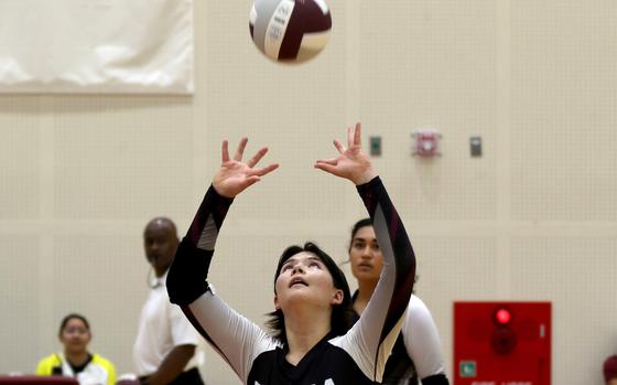 Zama American's Remi Sherratt sets against Matthew C. Perry during Friday's DODEA-Japan volleyball match. The Trojans won in straight sets.