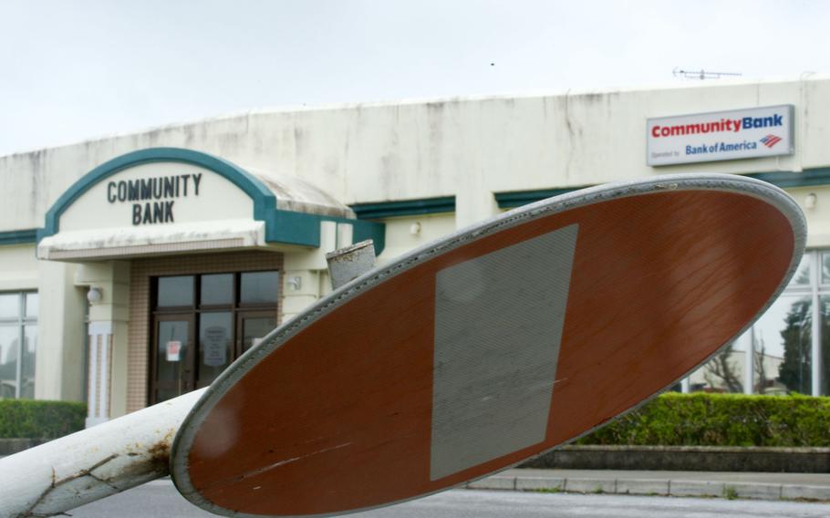 A do-not-enter sign, broken by Typhoon Khanun, leans near a bank at Camp Foster, Okinawa, Thursday, Aug. 3, 2023.