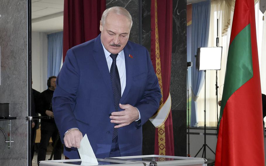 Belarusian President Alexander Lukashenko casts his ballot at a polling station during the referendum on constitutional amendments in Minsk, Belarus, Sunday, Feb. 27, 2022. 