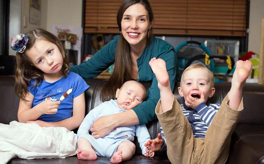 Janica Sims poses with her three children in this undated family photo.