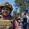 A military child tries on body armor during a Memorial Day event at Misawa Air Base, Japan, May 30, 2022.