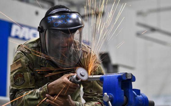 U.S. Air Force Senior Airman Armani Everson, 305th Maintenance Squadron Fabrication Flight aircraft structural maintenance journeymen, cuts into a piece of titanium used for aircrafts on Joint Base McGuire-Dix-Lakehurst, New Jersey, Oct. 16, 2019. Utilizing various methods, aircraft structural maintenance Airmen are able to build a replacement part from scratch in order to restore the structural integrity of the aircraft and ensure the safety of the Airmen who fly them. The mission of the 305th MXS is to enhance global response by providing world class systems, support equipment, munitions and aircraft maintenance.